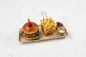 Juicy grilled burger new at Moda Cafe featuring fresh ingredients and flavorful sides.